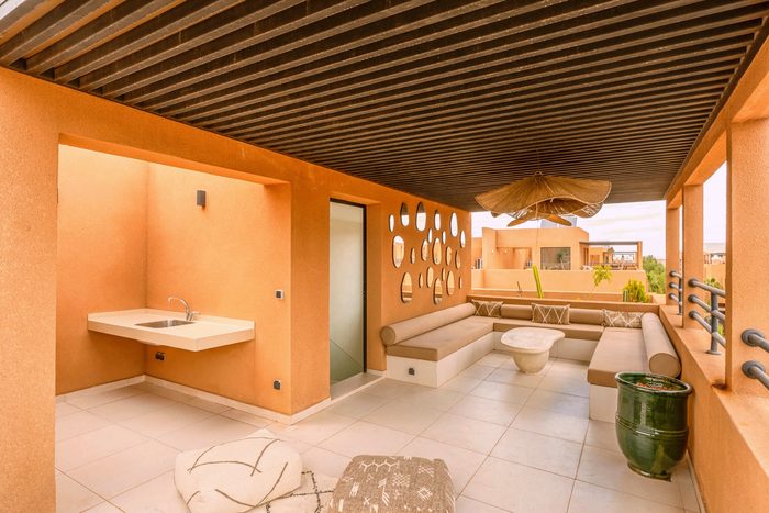 The straw parasols on the rooftop
