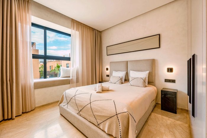 Atlas suite — the bedroom and its window onto the garden