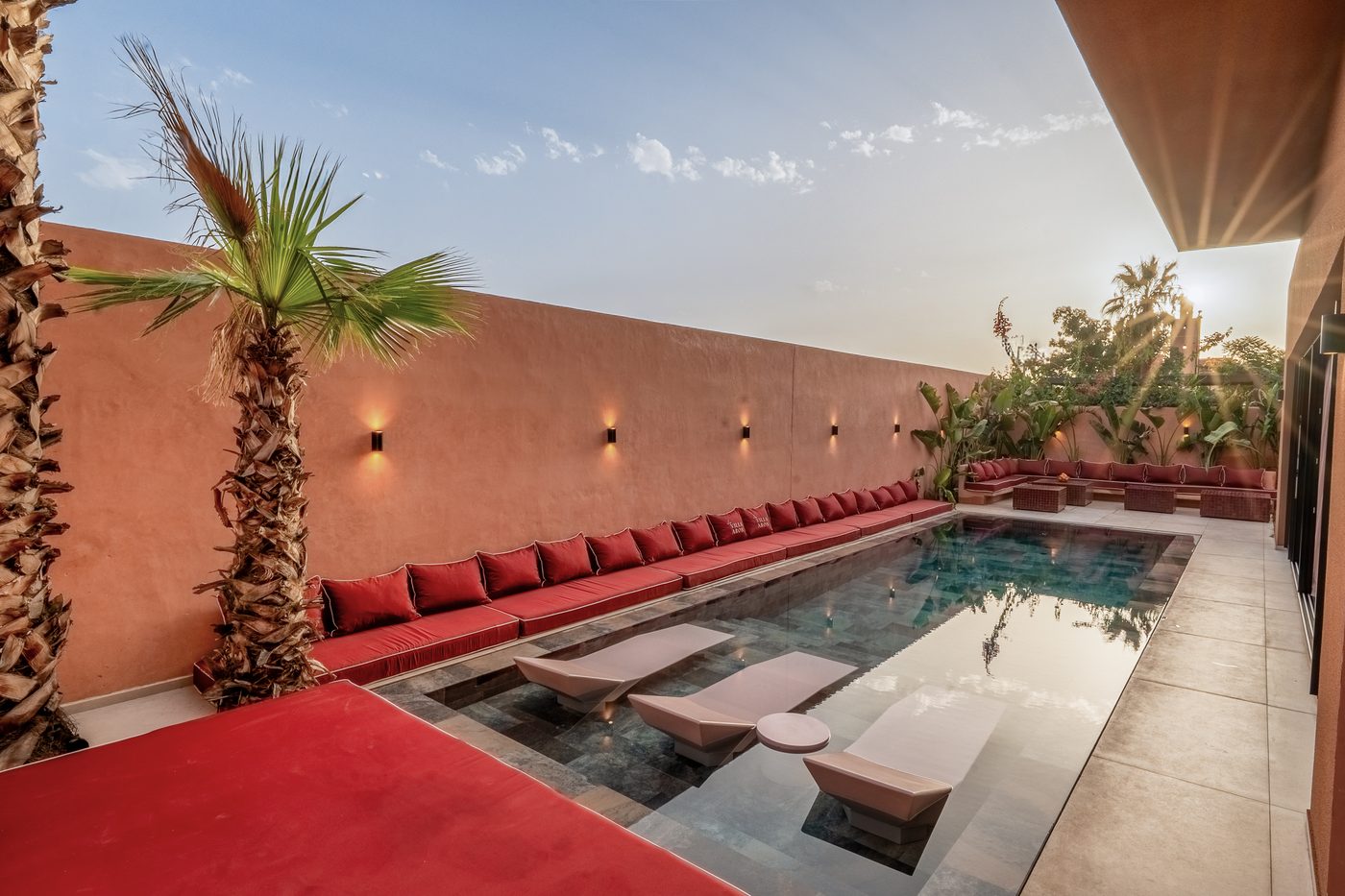 The pool at Villa Aron and its terracotta daybeds